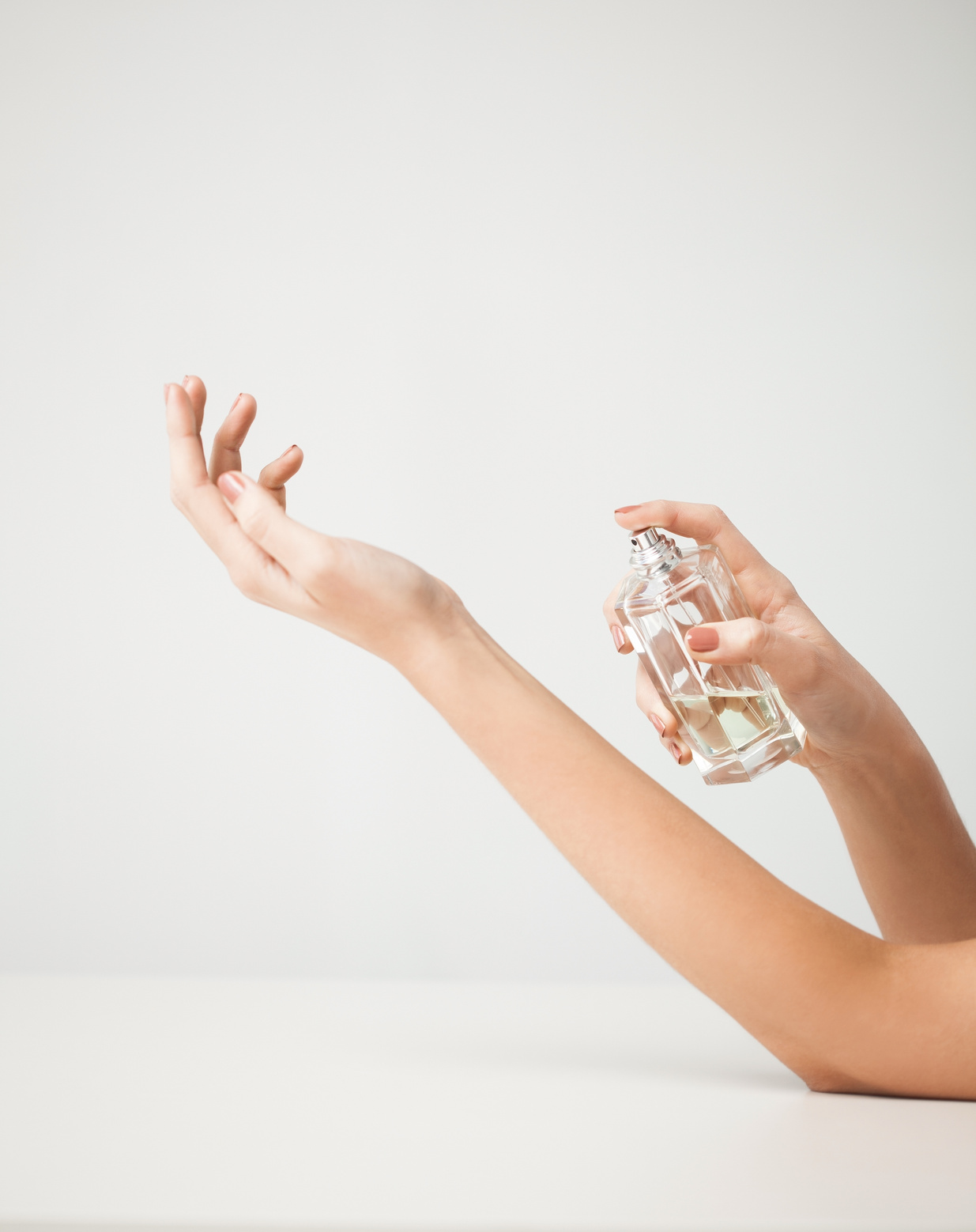 Woman Hands Spraying Perfume